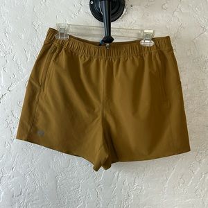 Janji Women's Athletic Shorts in Mustard Brown